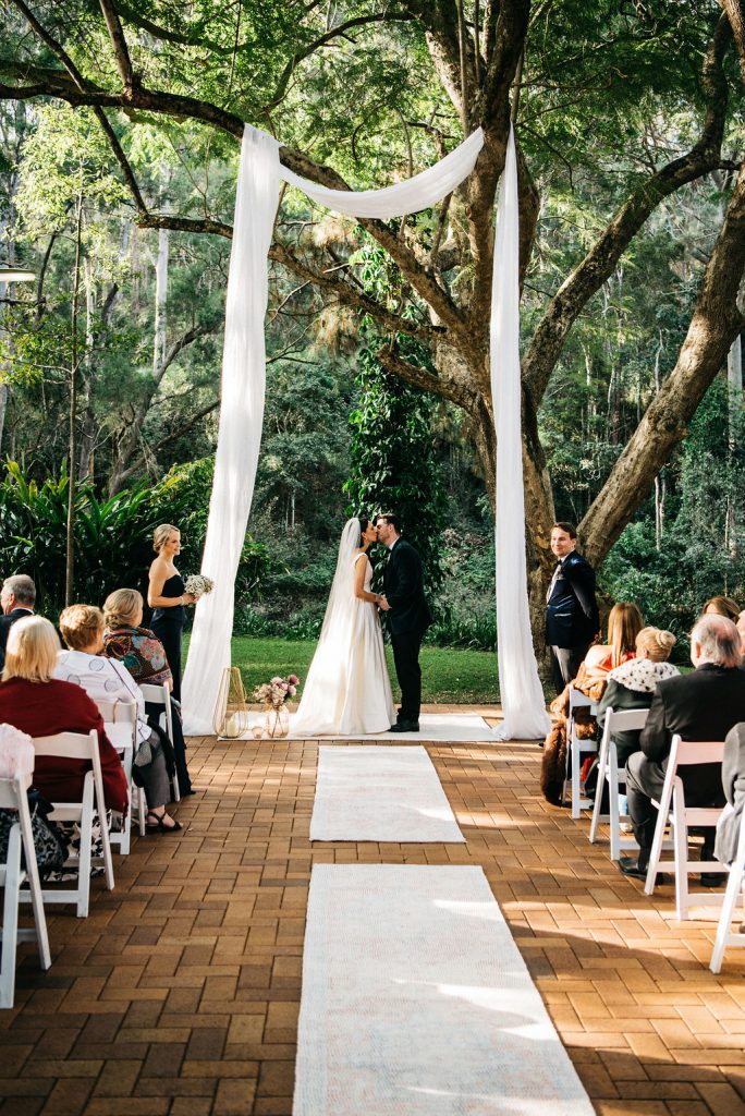 Brisbane outdoor wedding ceremony jacaranda tree